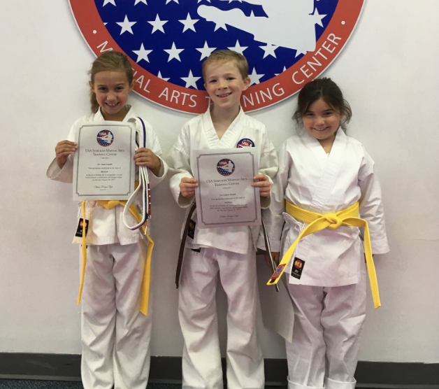 3 students with certificates